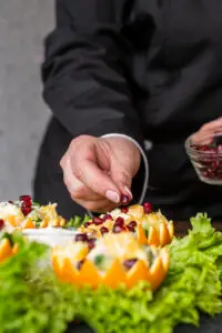 chef preparing fruit dish